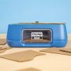 ChompSaw kid-safe cardboard cutter, front view with cut cardboard pieces