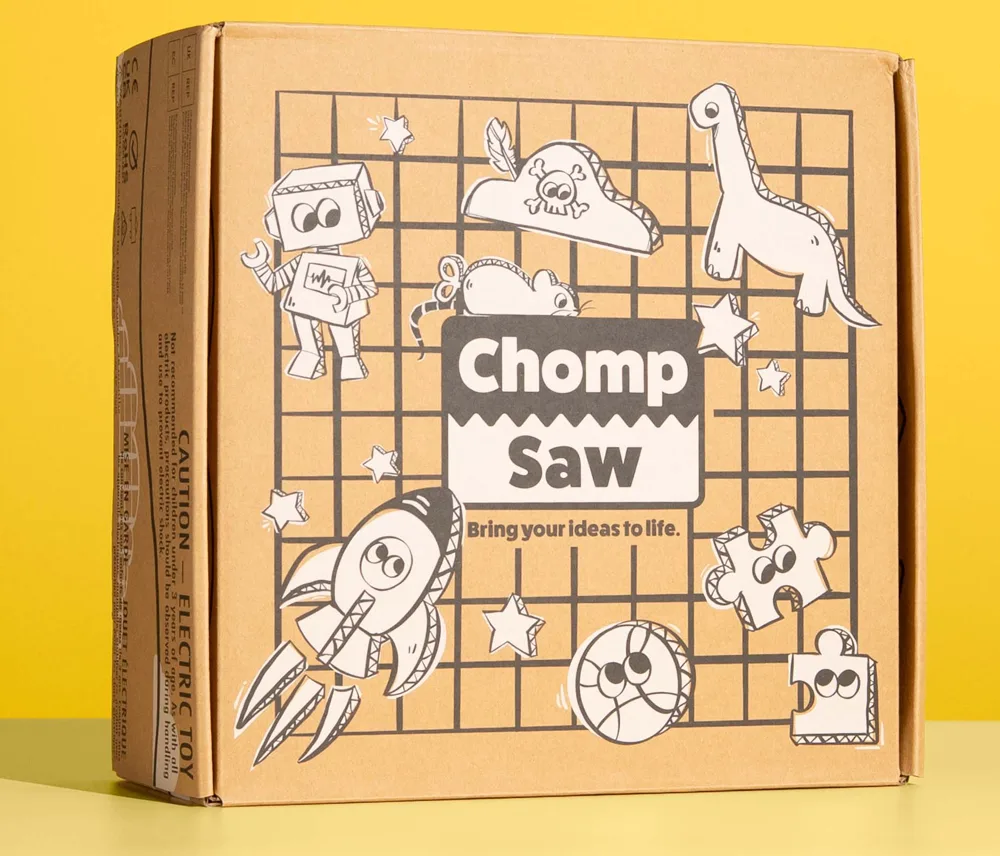 ChompSaw retail box with rocket and dinosaur cardboard illustrations