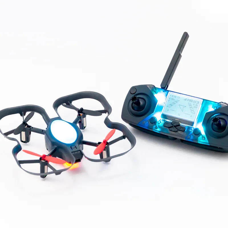 Two CoDrone EDU drones beside a Smart Controller