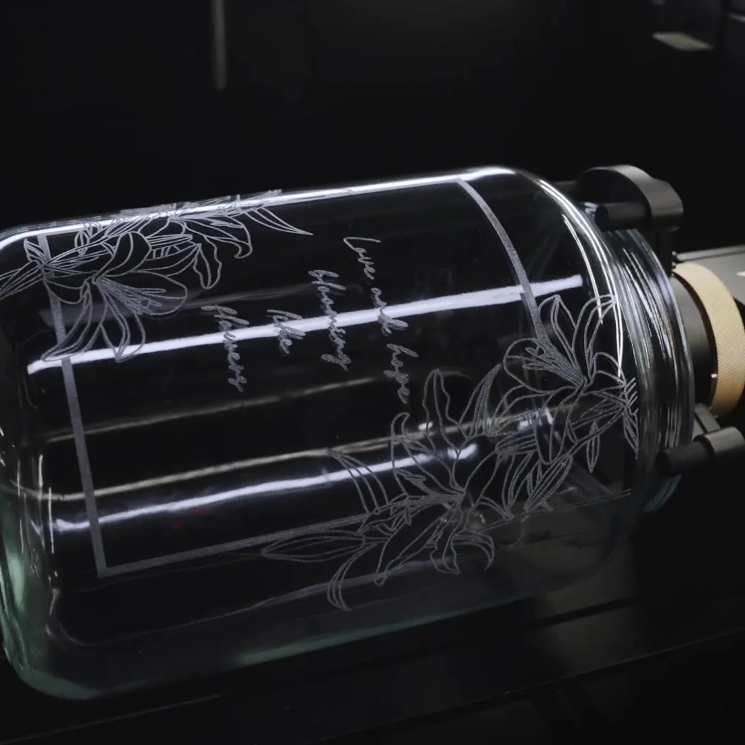 A glass jar engraved on the rotary attachment