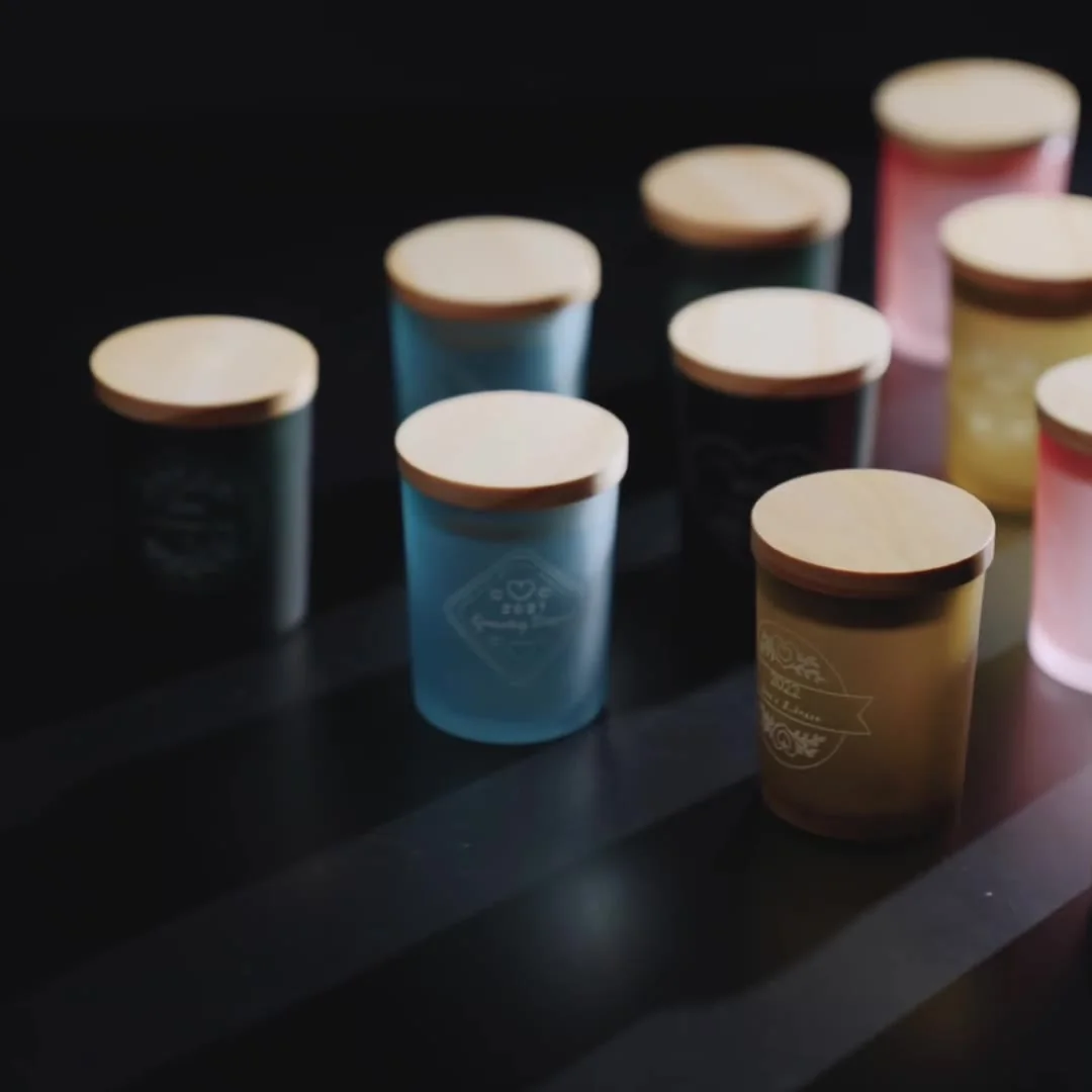 Engraved candle jars finished on the conveyor feeder
