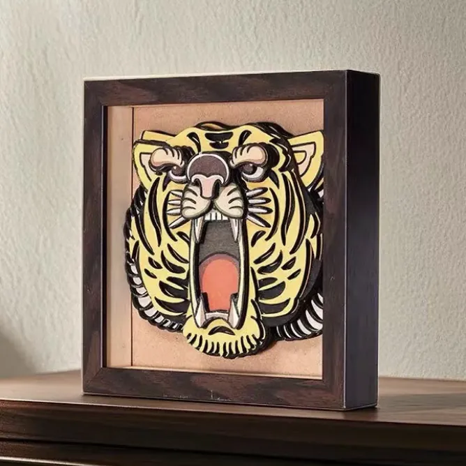 A raised-texture tiger printed on wood in a frame